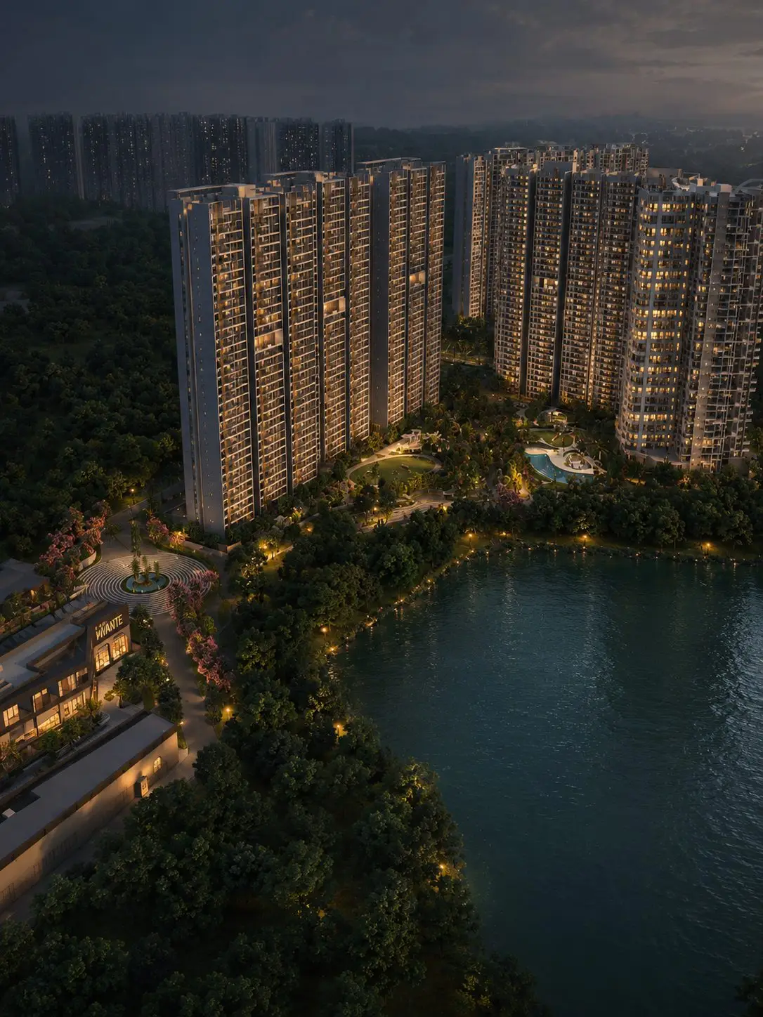 Aerial view of Mana Skanda luxury apartment towers with lake and landscaped greenery in Bangalore